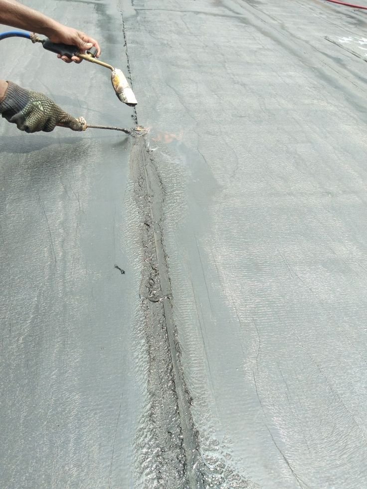 Aquacraft technician inspecting a site for leaks and moisture damage
